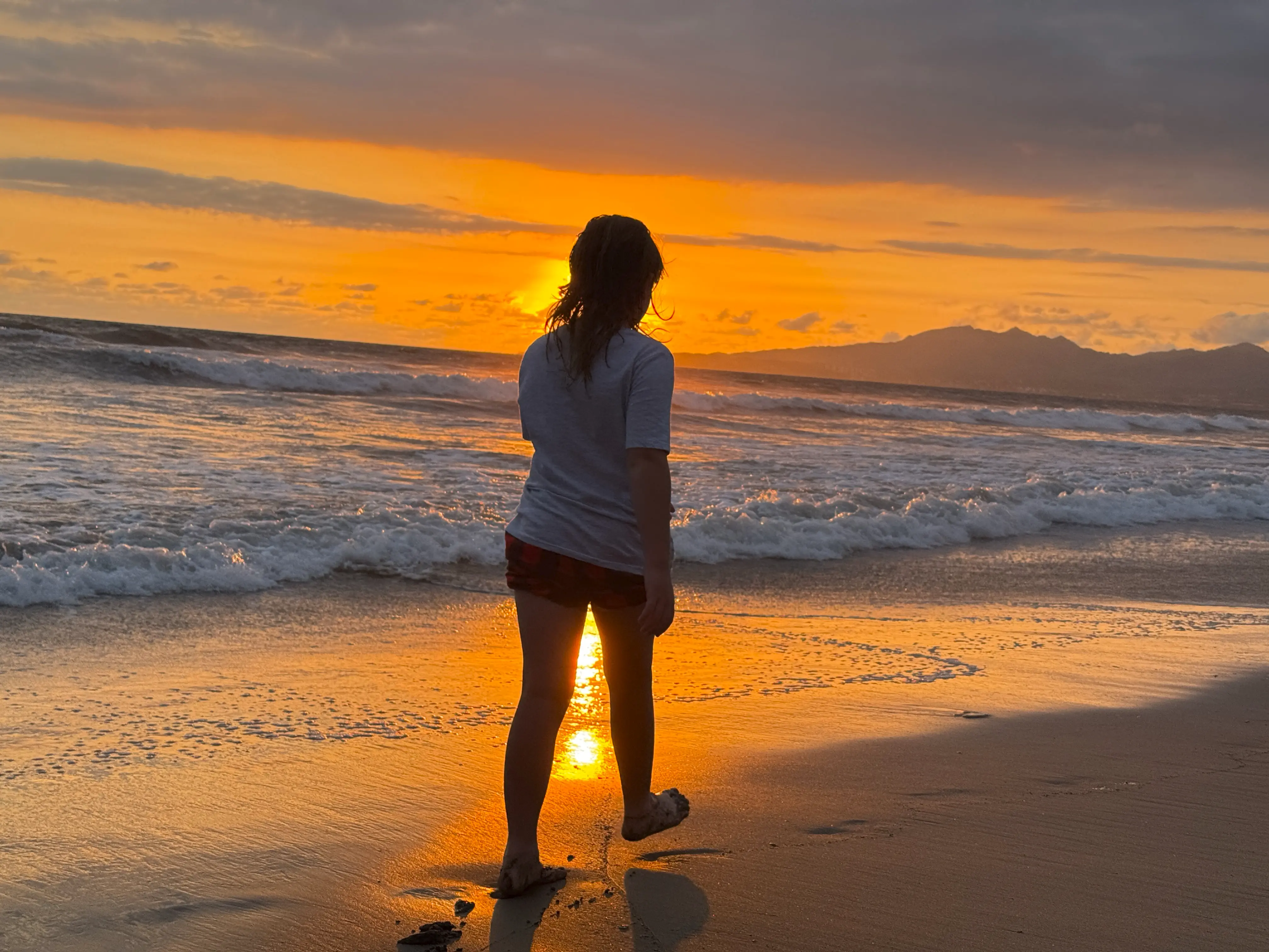 Child at sunset on the beach in Mexico